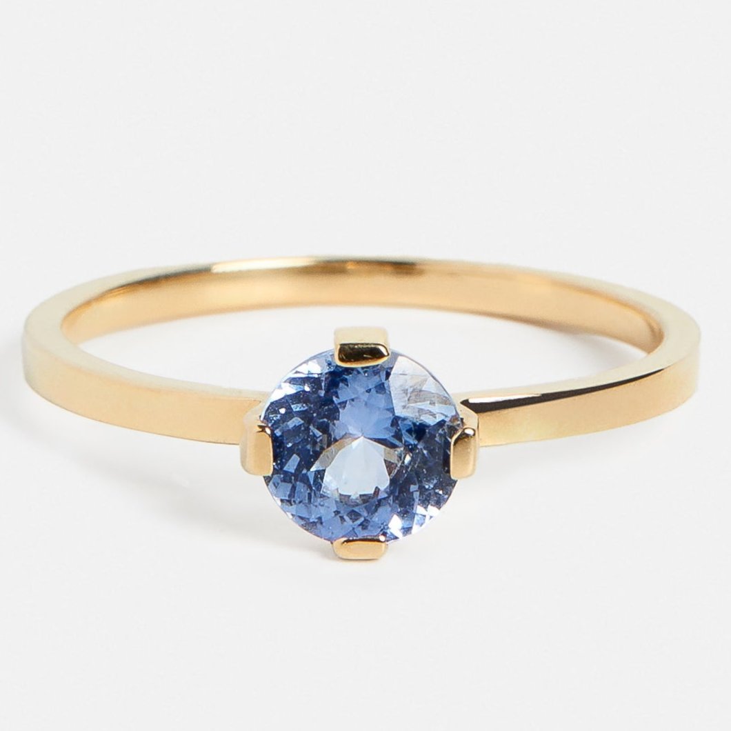 Minimalist Thin Band Engagement Ring with 0.75ct pale blue sapphire in 14 karat yellow gold by SHW coolest fine jewelry store in NYC nearby