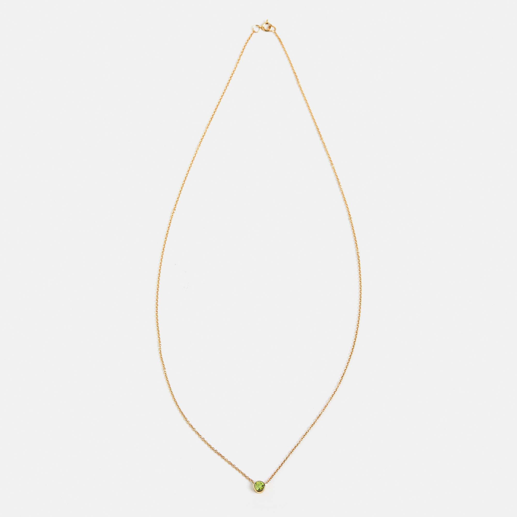 Delicate 18 inch necklace with round green peridot pendant in 14 karat gold by SHW best fine jewelry store in NYC