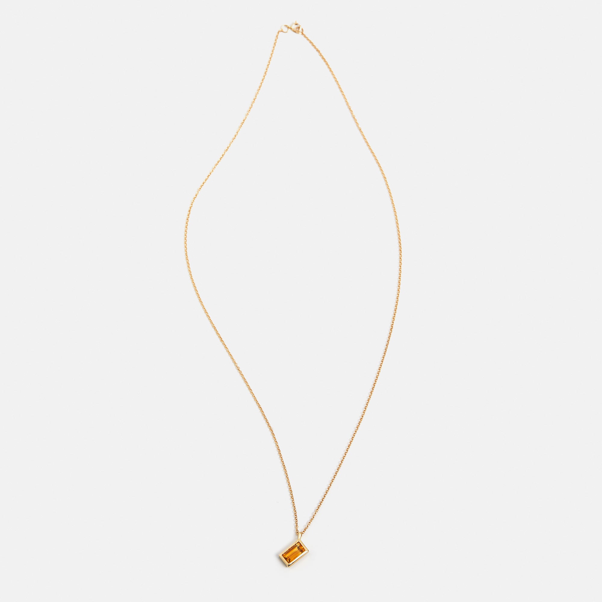 Minimalist necklace with dainty chain and orange citrine pendant in 14k or 18k gold by SHW famous fine jewelry store in NYC East Village