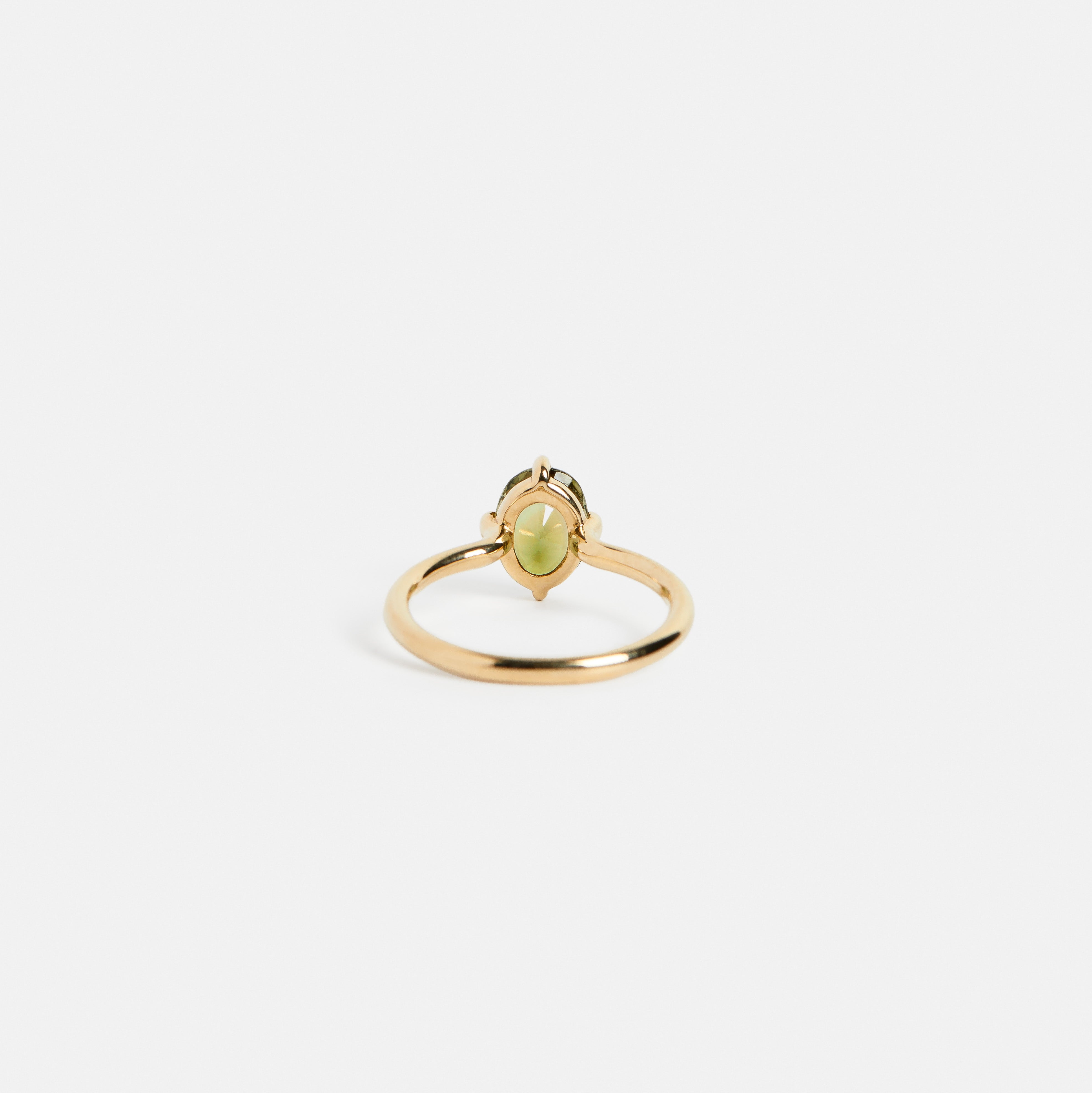 Classic modern prong set engagement ring design with 1.5 carat oval light green tourmaline stone in 14k yellow gold by SHW fine jewelry NYC