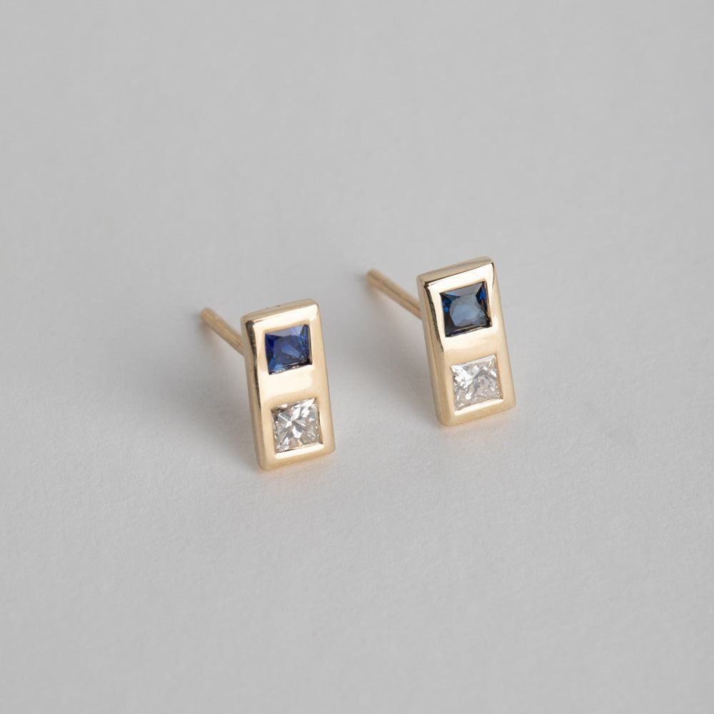 14 karat yellow gold designer earrings set with diamond and sapphire