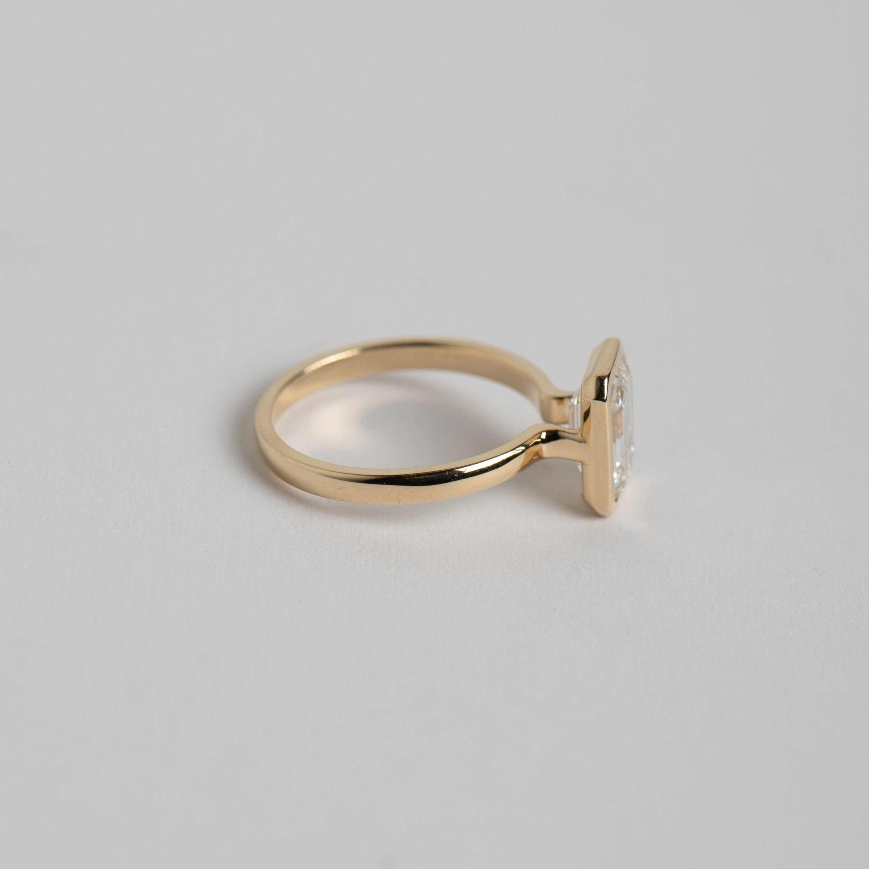 Cool Bezel Engagement Ring with 1.50 ct certified emerald cut lab made diamond  in 14k yellow gold by SHW famous fine jewelry stores NYC