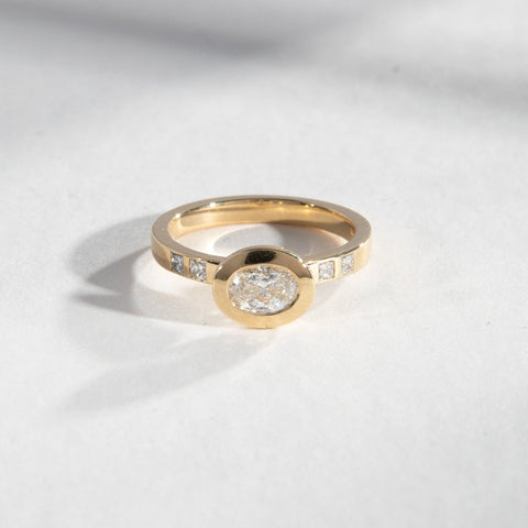 Wide Diamonds on Band Bezel Engagement Ring with Oval Lab created Diamond in 14k yellow gold SHW famous fine jewelry stores in NYC