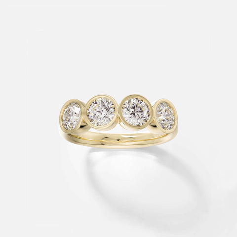 14k yellow gold wedding band with four bezel-set round brilliant diamonds