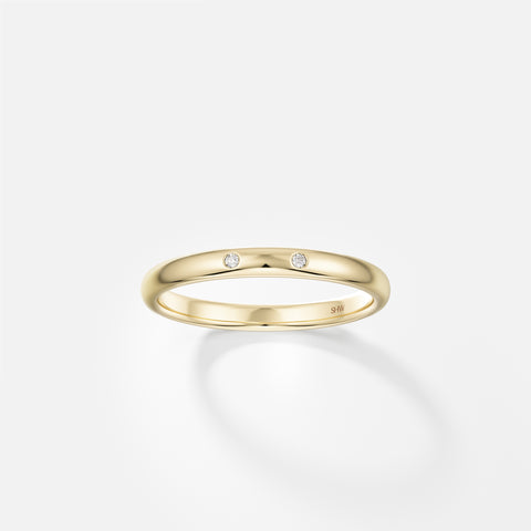 14k yellow gold 2mm domed wedding band with two small round brilliant diamonds