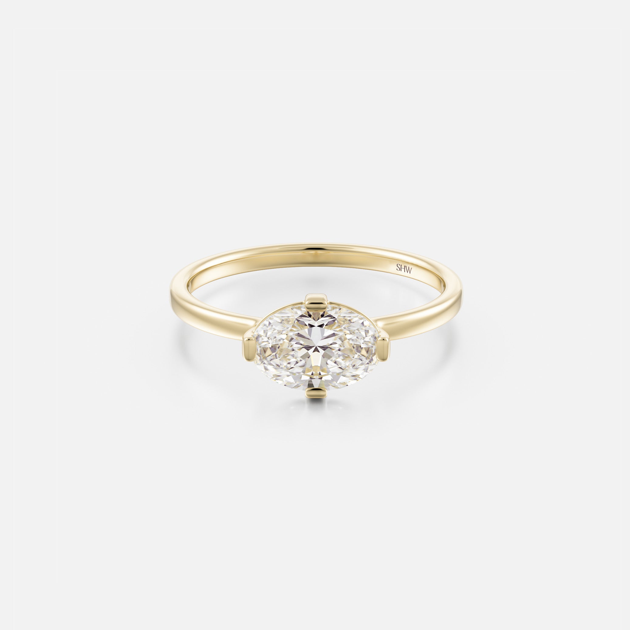 14k yellow gold engagement ring with 1ct east-west oval diamond and compass prongs