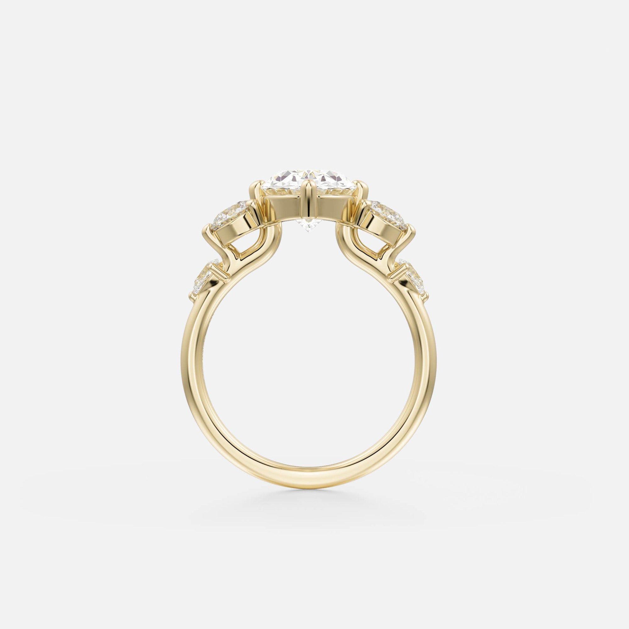 side view of oval diamond five stone engagement ring with pear and round side stones on thin round band