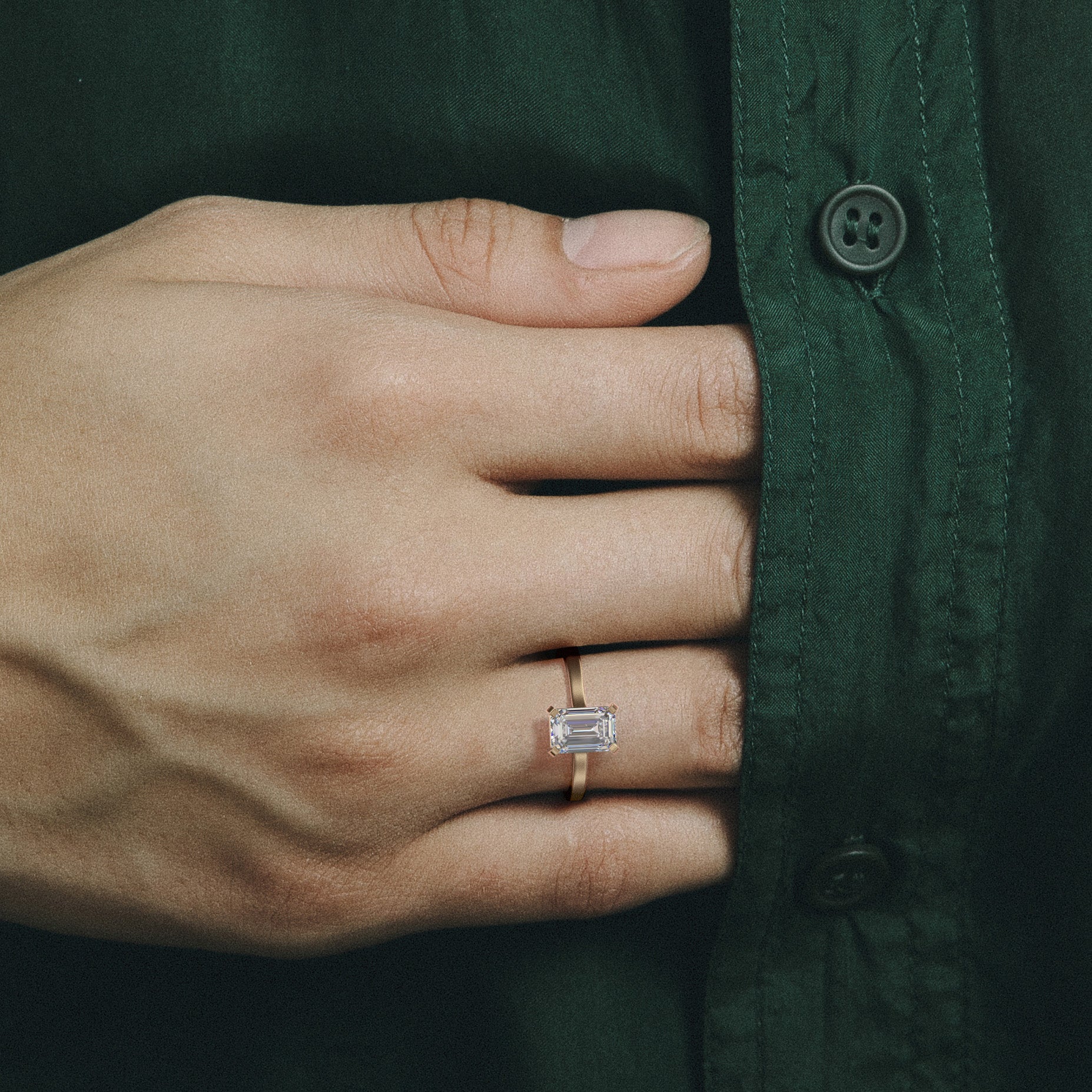 Contemporary emerald solitaire engagement ring with vertical orientation and thin flat band, 14k 18k SHW coolest fine jewelry NYC