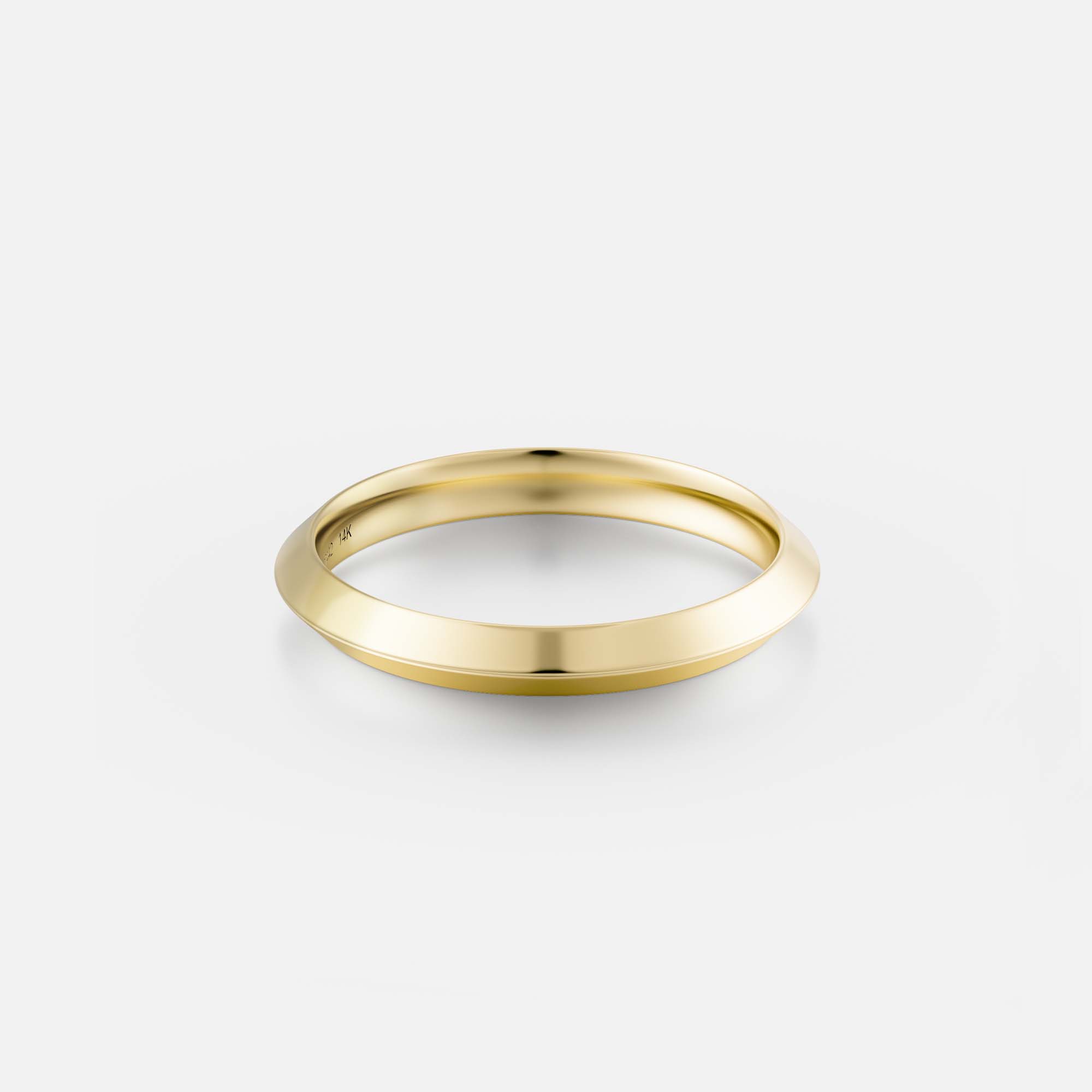 Close front view of a solid gold knife edge wedding band