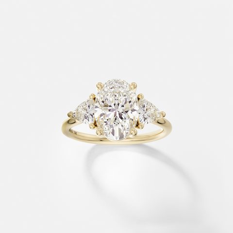 Oval cut engagement ring with trillion side diamonds three stone cluster 14k 18k gold platinum SHW Fine Jewelry NYC