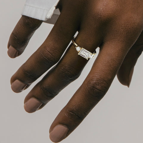 3 Stone emerald cut ring with round diamond accents east west setting 14 karat gold platinum SHW fine jewelry NYC