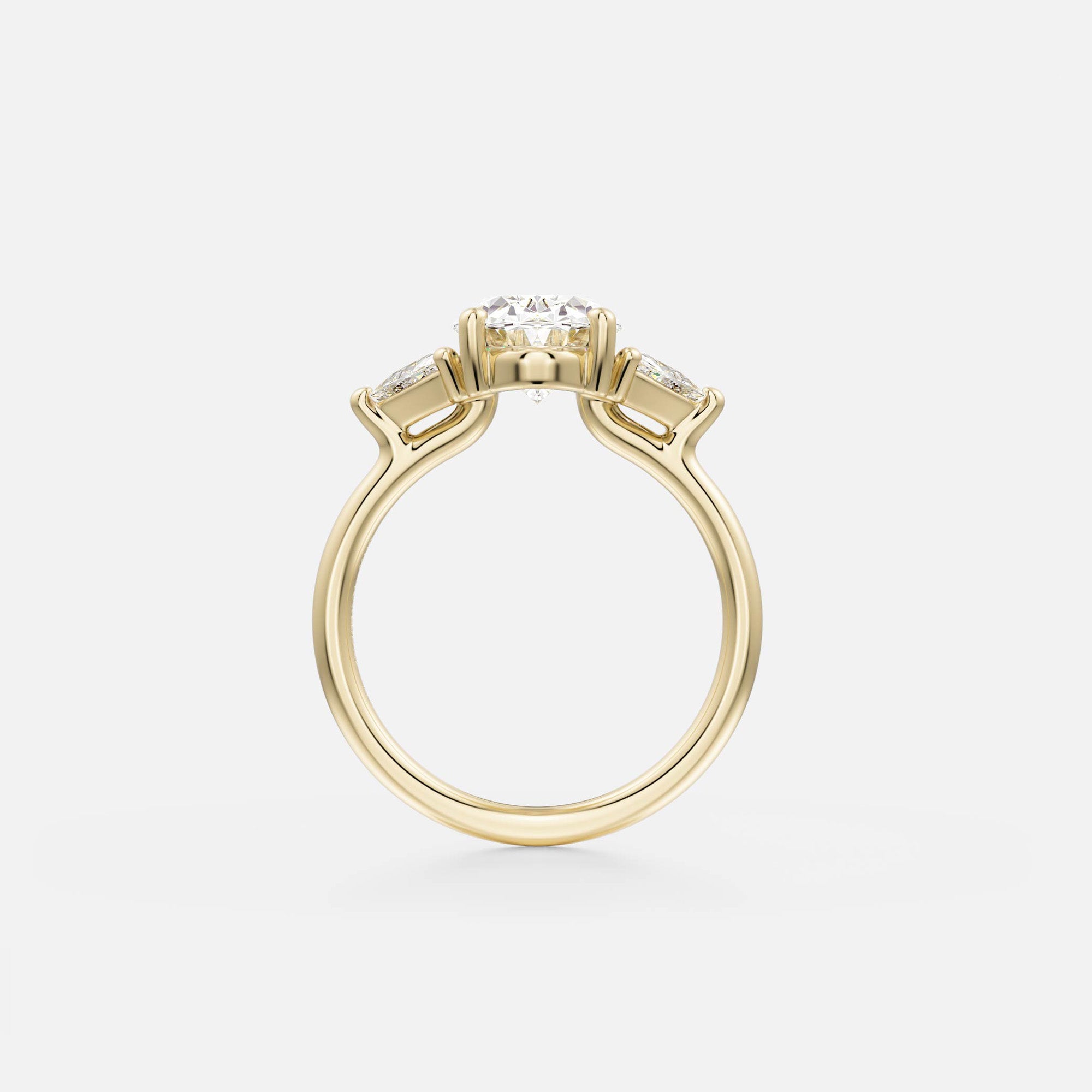 side view of oval diamond three stone engagement ring with trillion-cut side diamonds on thin round band
