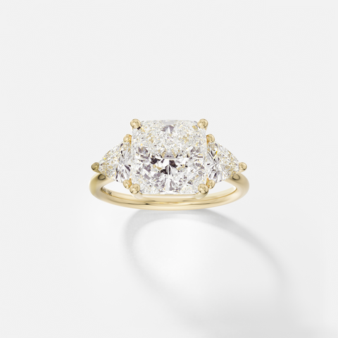 14k yellow gold three stone engagement ring with 3.50 carat square cushion-cut diamond and trillion side stones in corner prong setting