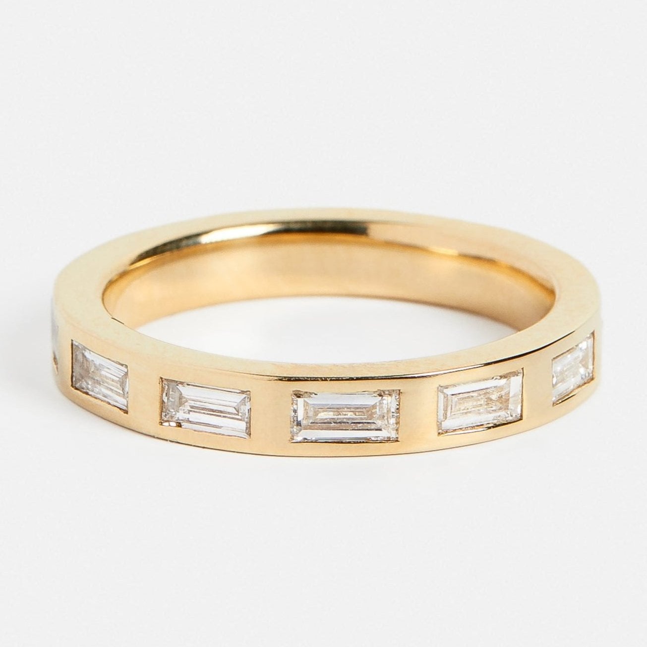 Modern womens thick wedding band with eternity of baguette white diamonds in 14k yellow, white, rose gold, platinum by SHW fine jewelry NYC
