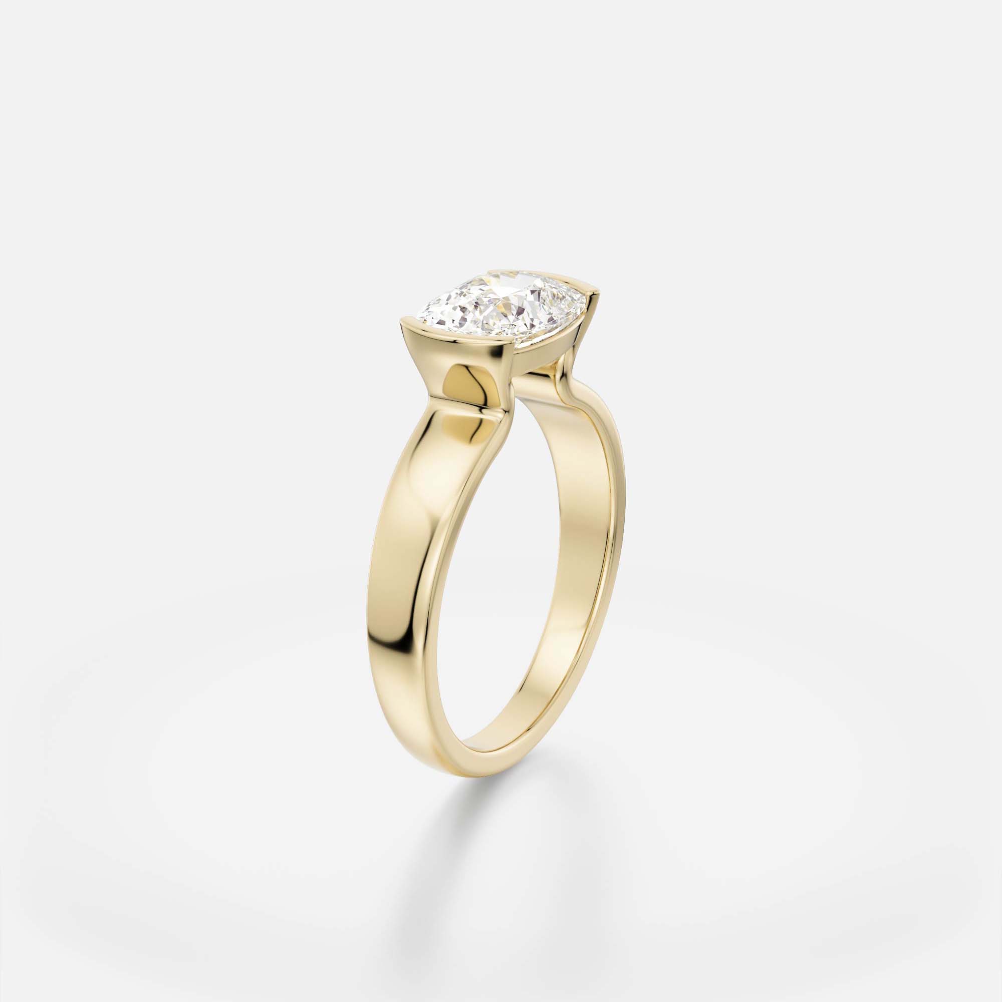 2 ct east west cushion diamond engagement ring with tapered partial bezel setting on sculptural band