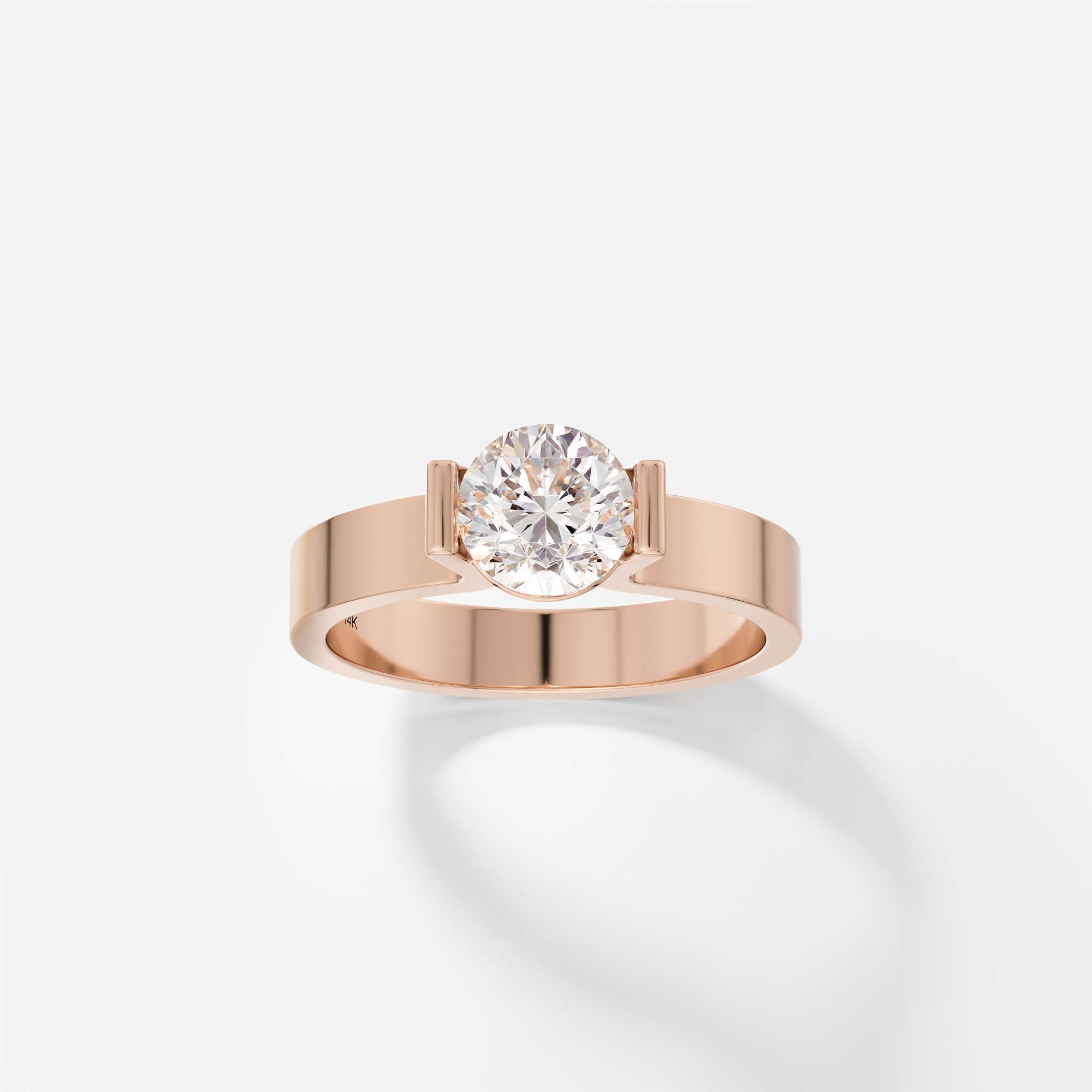 14k rose gold sculptural engagement ring with round diamond in partial bezel setting
