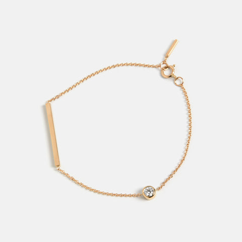 Unique bracelet with dainty chain and asymmetrical lab grown white diamond in solid 14k gold by SHW cool fine jewelry store in NYC nearby