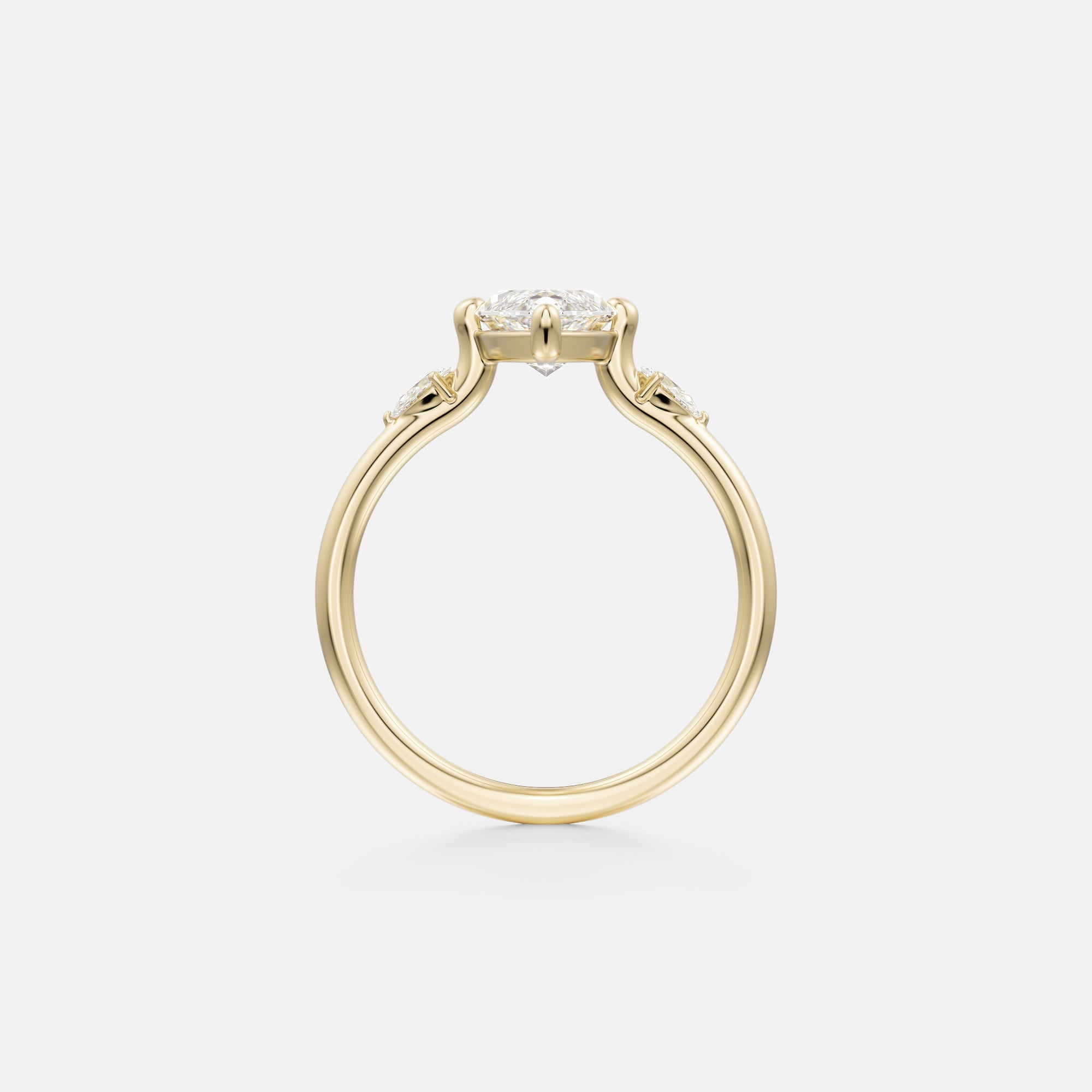 14 karat yellow gold engagement ring with marquise center diamond in compass prongs and pear-cut side stones set along band