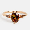 Minimalist stones on side engagement ring with neutral color gemstone and cognac pear cut diamonds in 18k rose gold by SHW jewelry in NYC