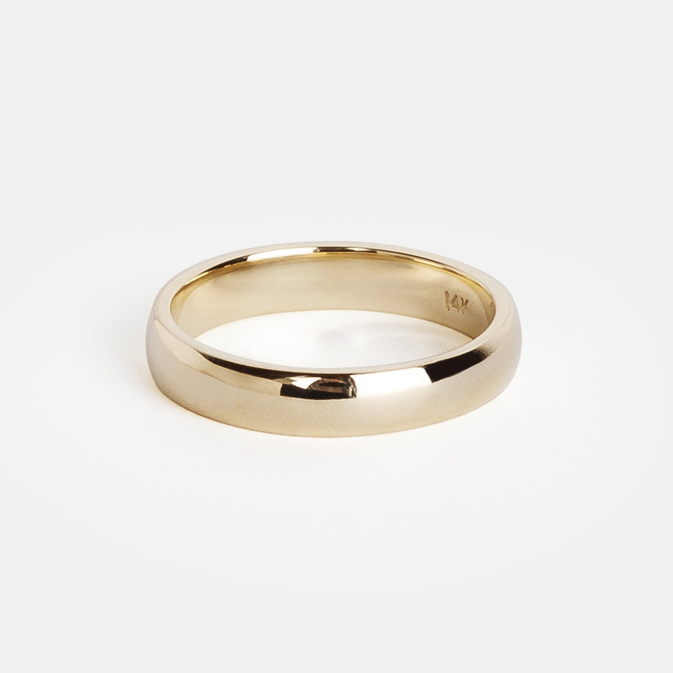 Close view of a 4mm domed gold wedding band