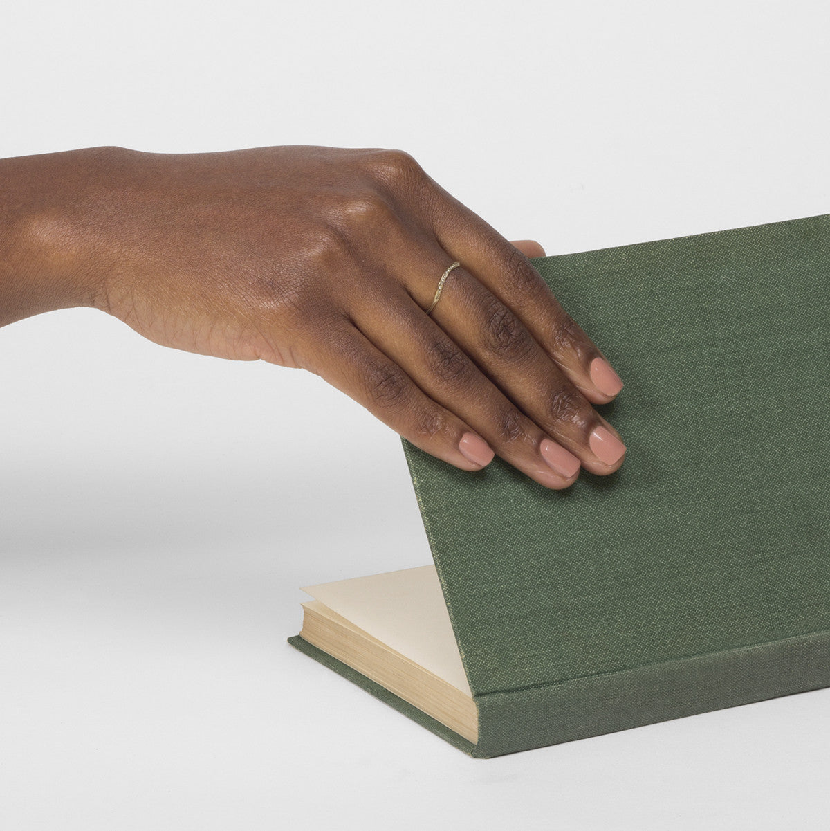 Curved pavé diamond band shown worn in natural light