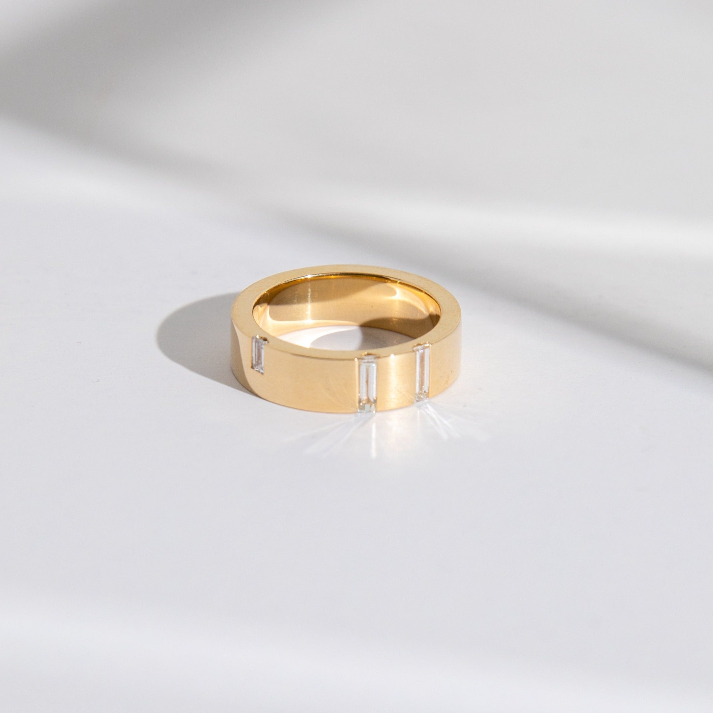 Modern Sculptural Wedding Band with embedded Baguette cut Diamonds set to edge in Solid 14 karat gold by SHW famous fine jewelry store NYC