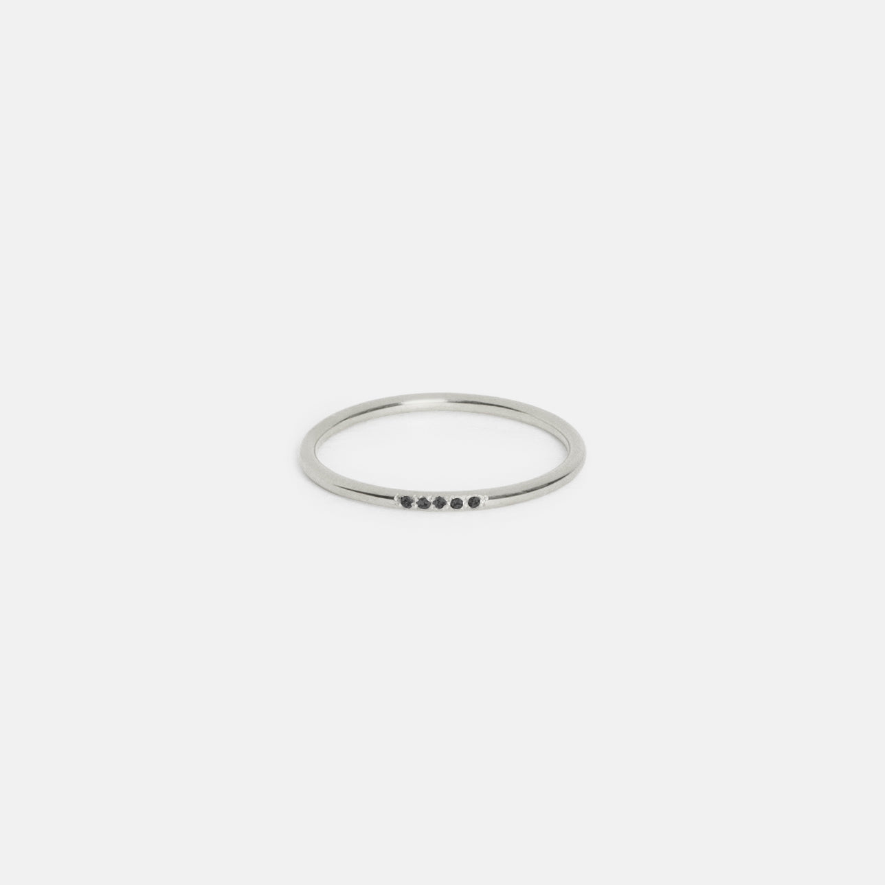14k white gold slim round band with five black diamonds