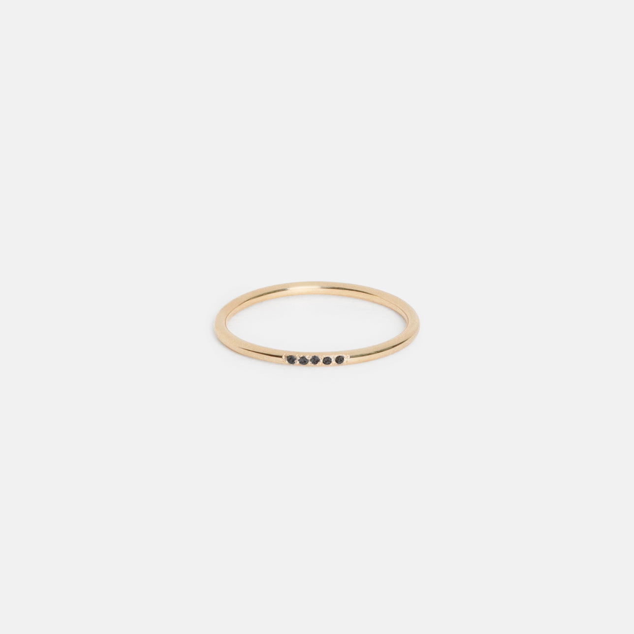 14k yellow gold thin wedding band with five pavé black diamonds