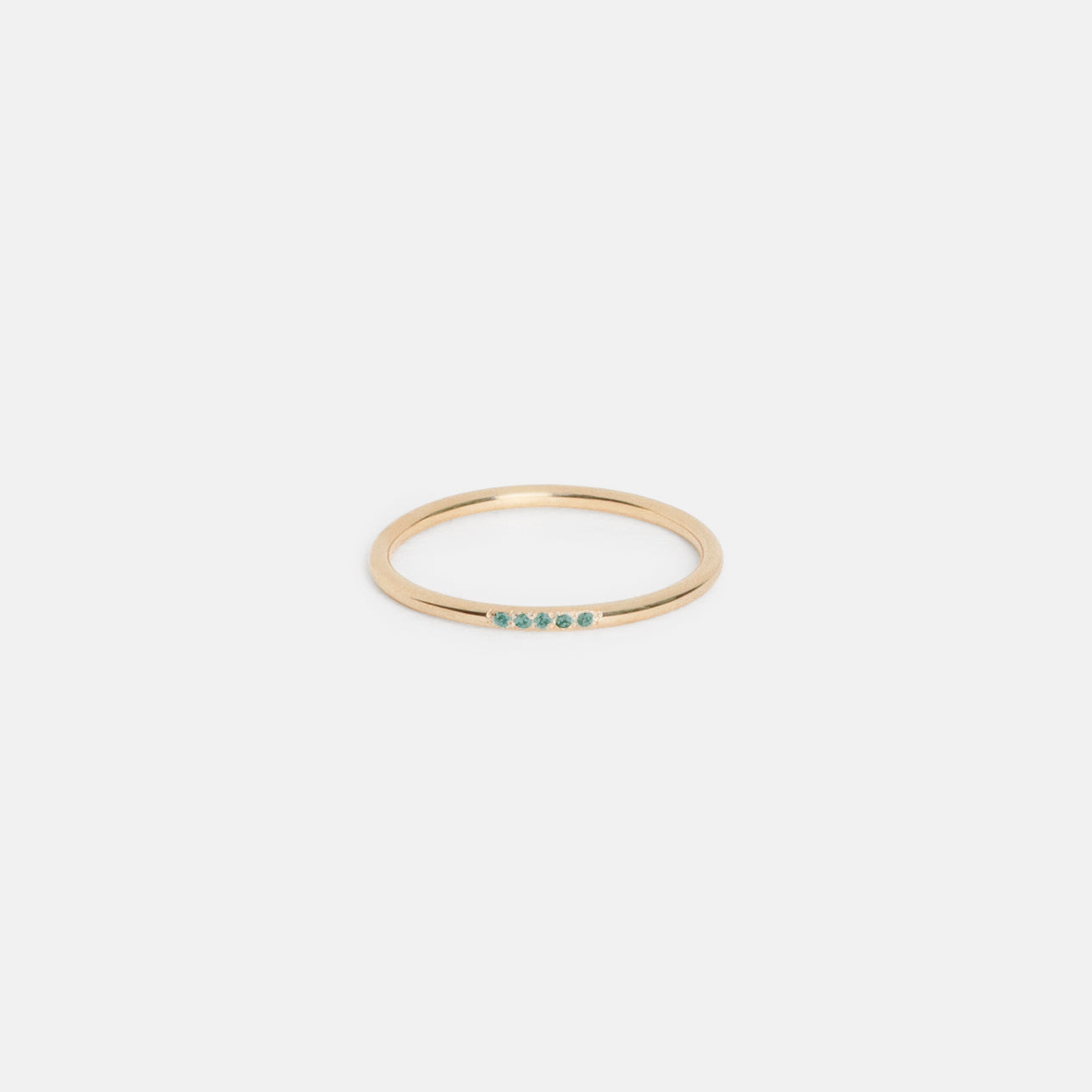 14k yellow gold thin wedding band with five pavé emeralds