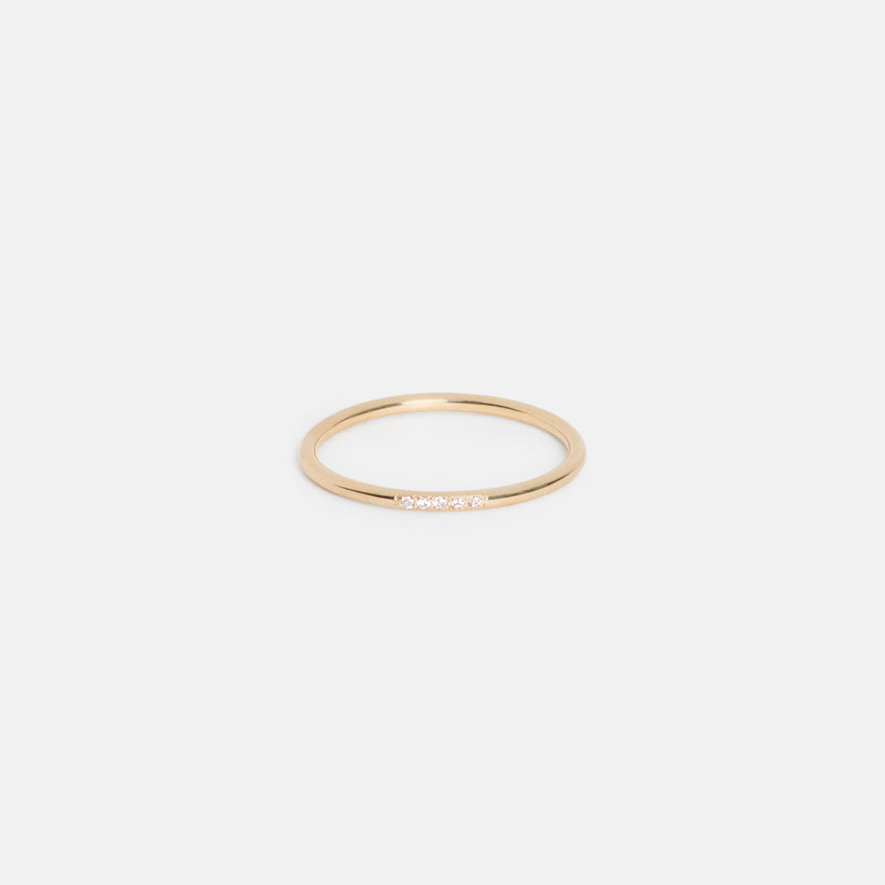 14k yellow gold thin round wedding band with five pavé white diamonds