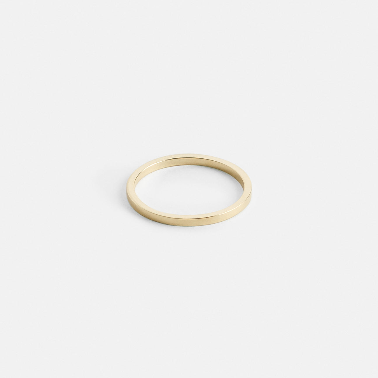 14k yellow gold thin flat wedding band with clean edges