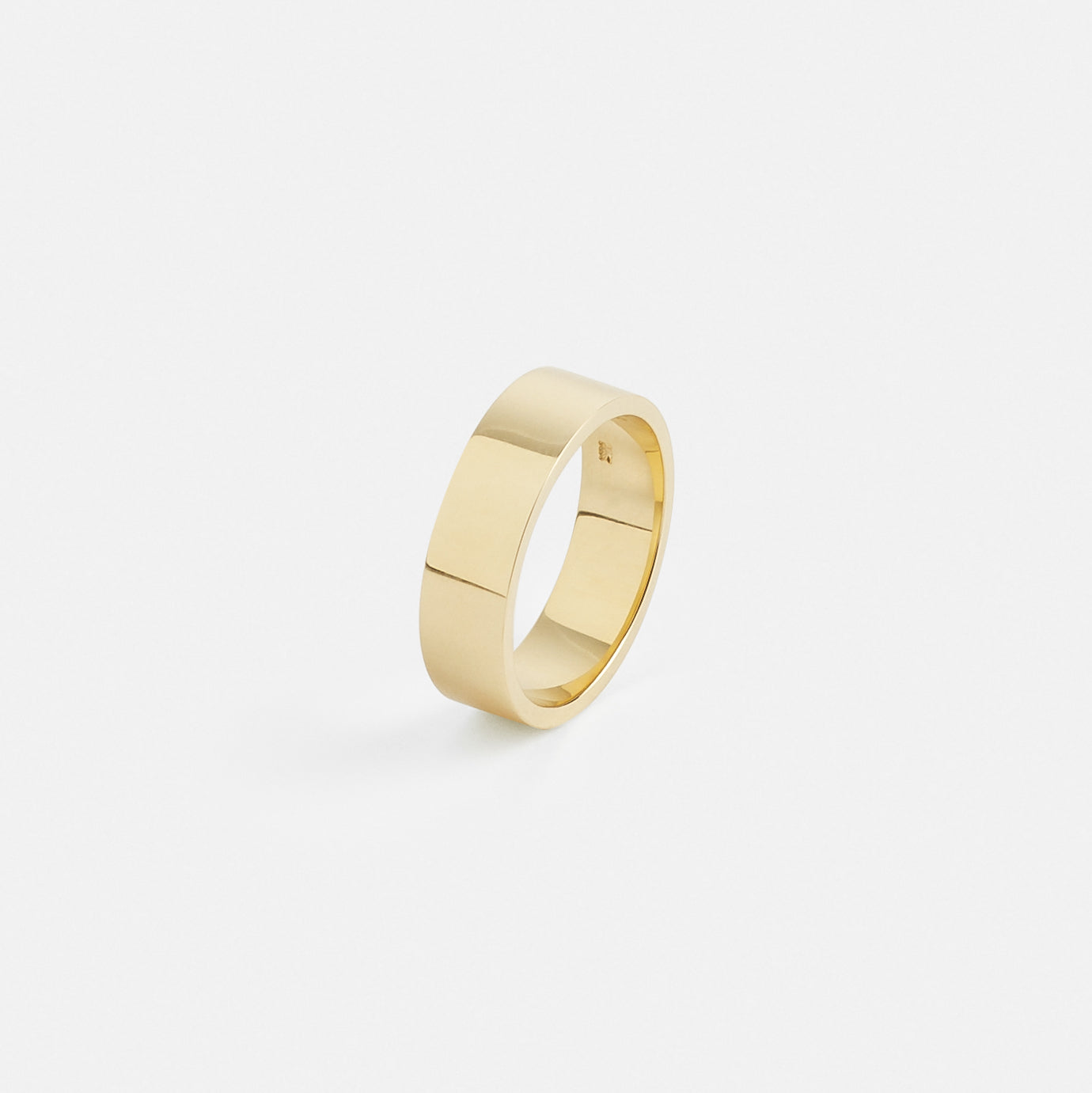 Side profile of a 6mm flat wedding band in solid yellow gold