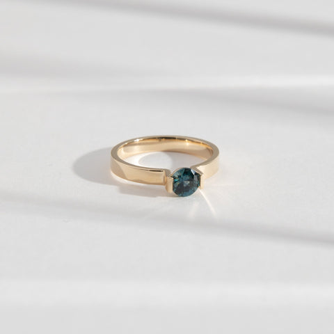 Lara Simple Ring in 14k Gold set with a 0.59ct round brilliant cut dark teal sapphire By SHW Fine Jewelry NYC