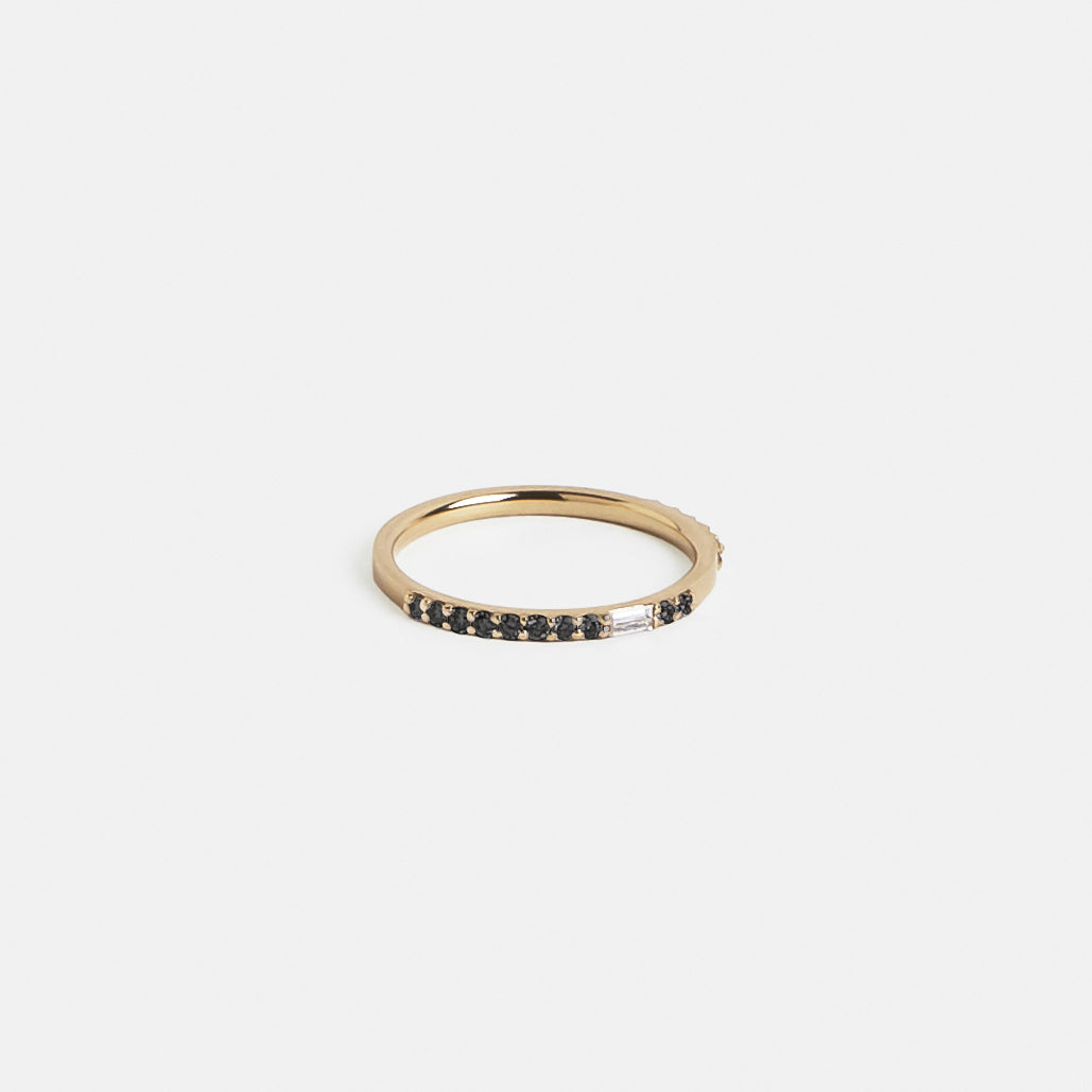 14k yellow gold eternity band with black round diamonds and white baguette diamonds