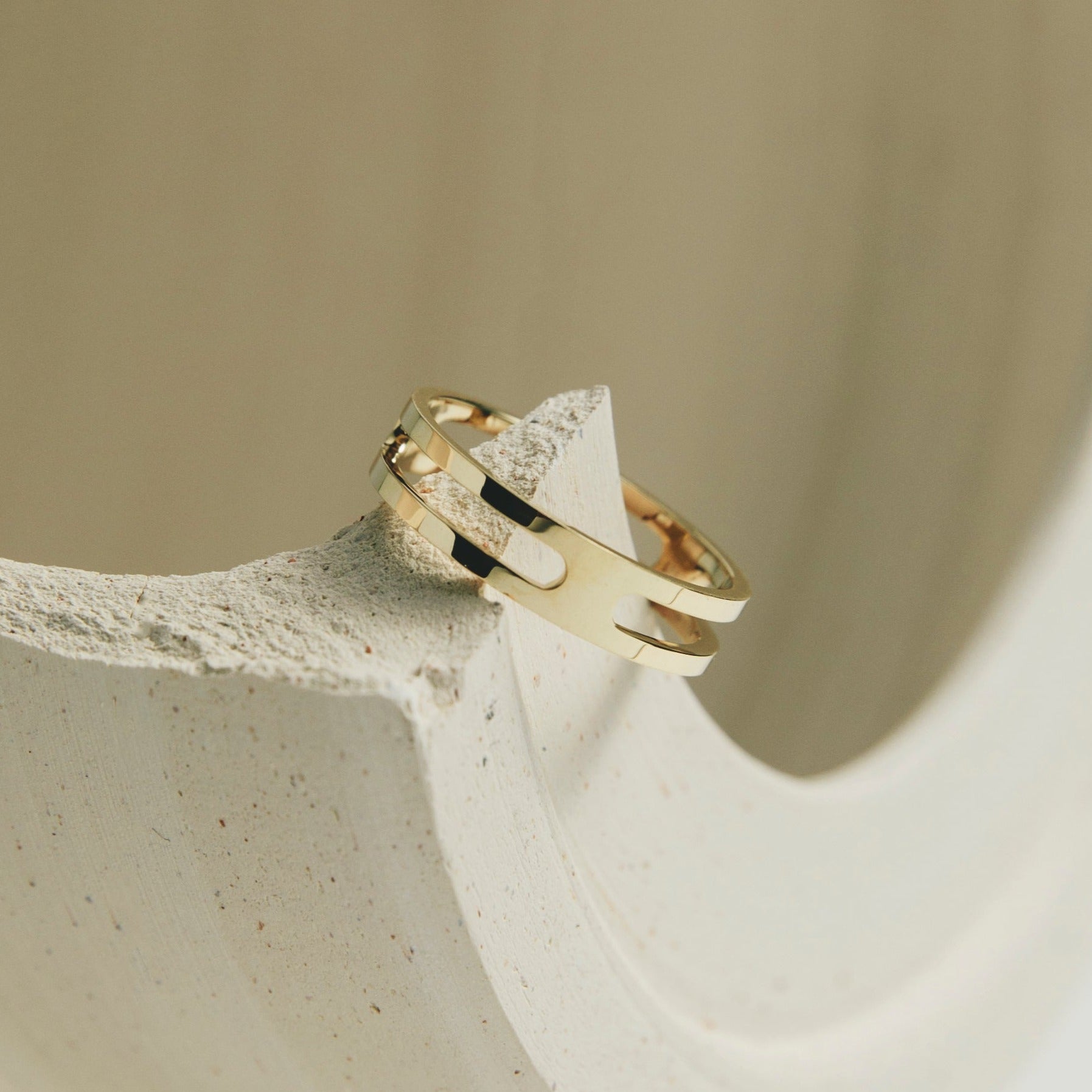 14k yellow gold ring shown at an angle in editorial styling