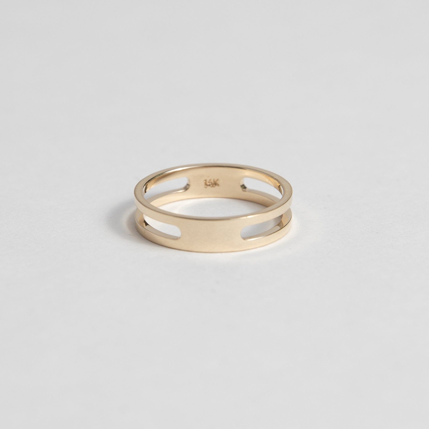 14k yellow gold double band ring with connected design and negative space