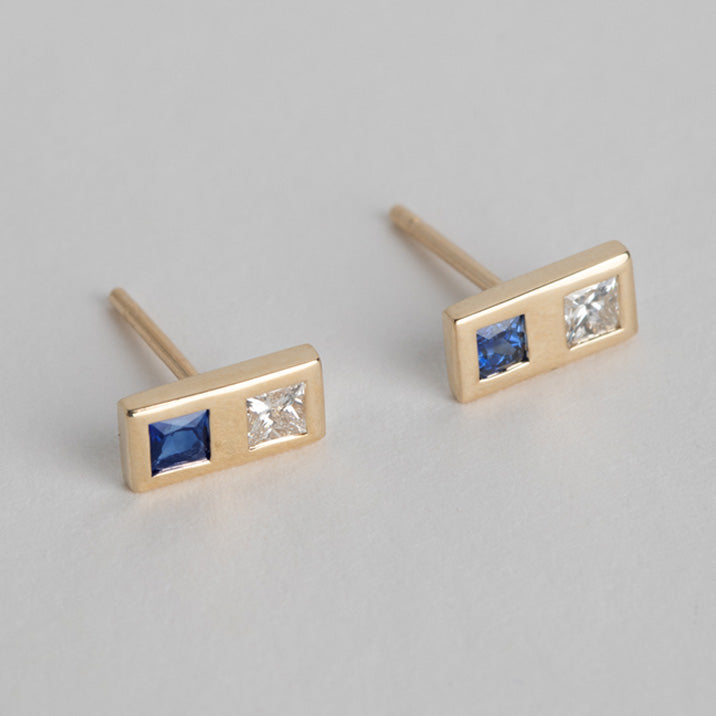 14 karat yellow gold designer earrings set with diamond and sapphire