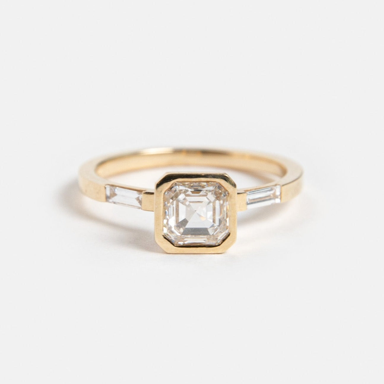Aida Designer Ring in 14 Karat Yellow Gold set with a square cut lab-grown diamond and two baguette cut lab-grown diamonds By SHW Fine Jewelry New York City