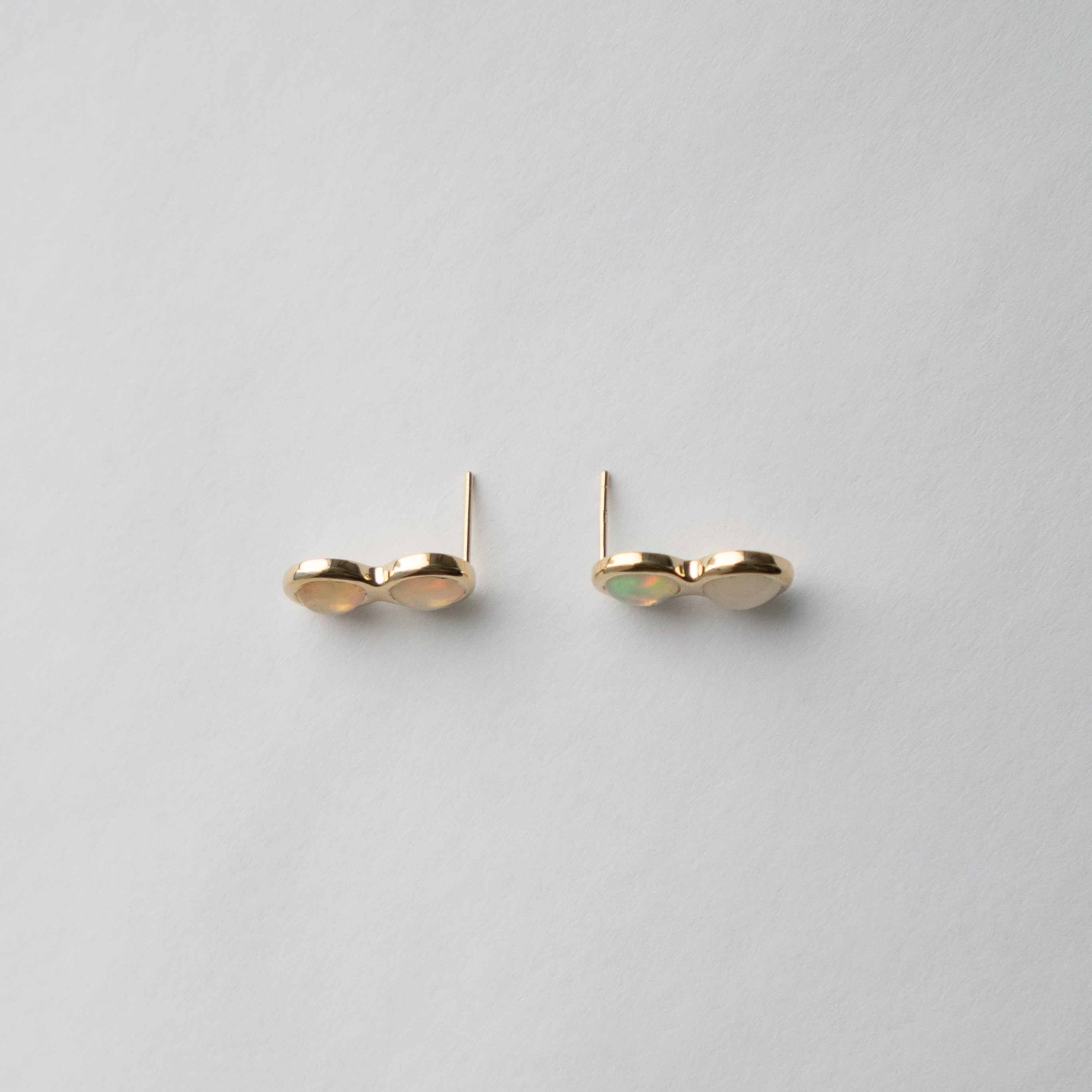 Unique Alia stud earrings in 14 karat yellow gold set with opal made in NYC by SHW fine Jewelry