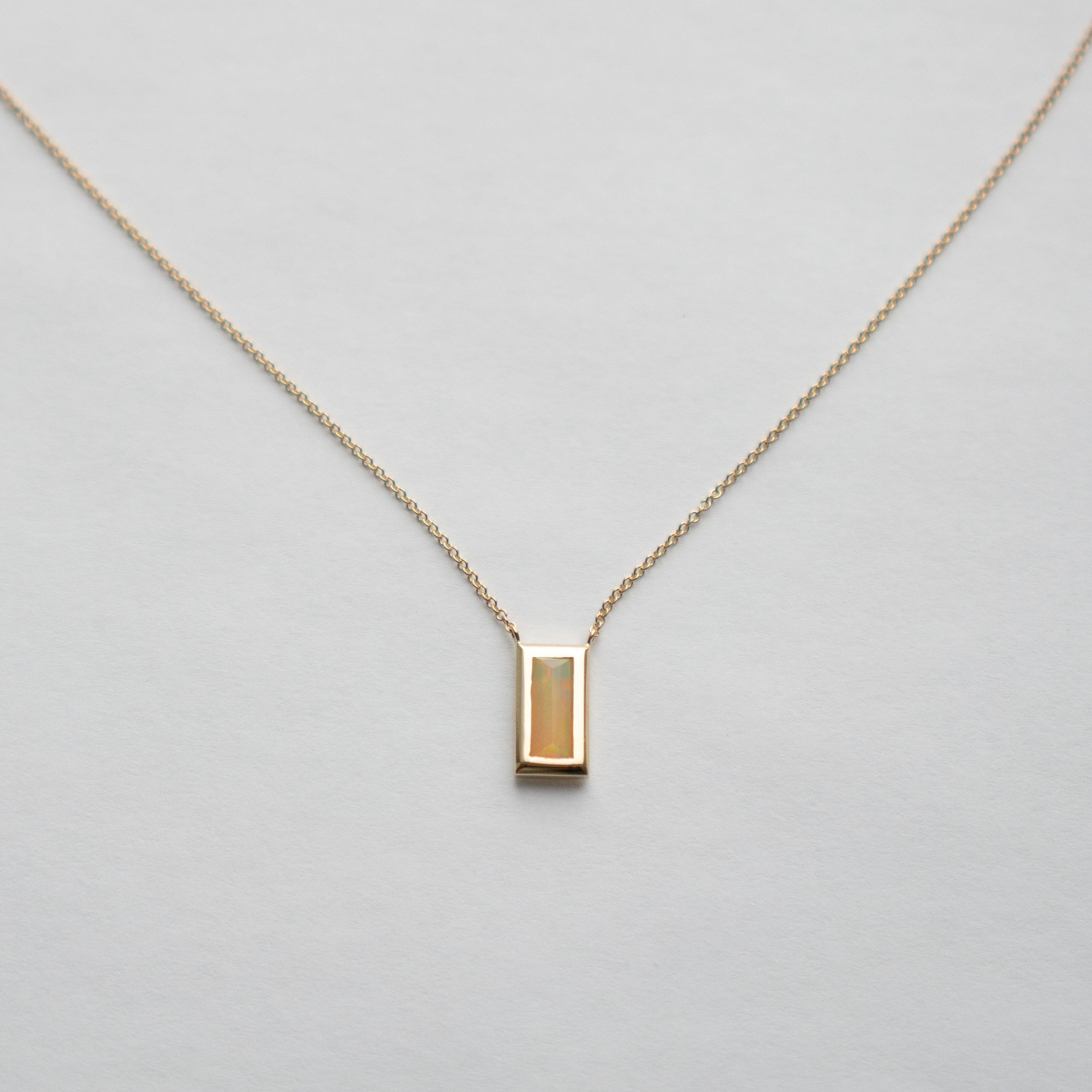 Designer Alia Necklace in 14 karat yellow gold set with baguette cut opal made in NYC by SHW fine Jewelry