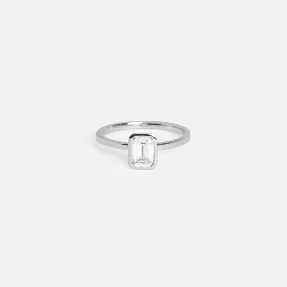 Auda Minimal Ring in Platinum set with a 0.82ct emerald cut natural diamond By SHW Fine Jewelry NYC