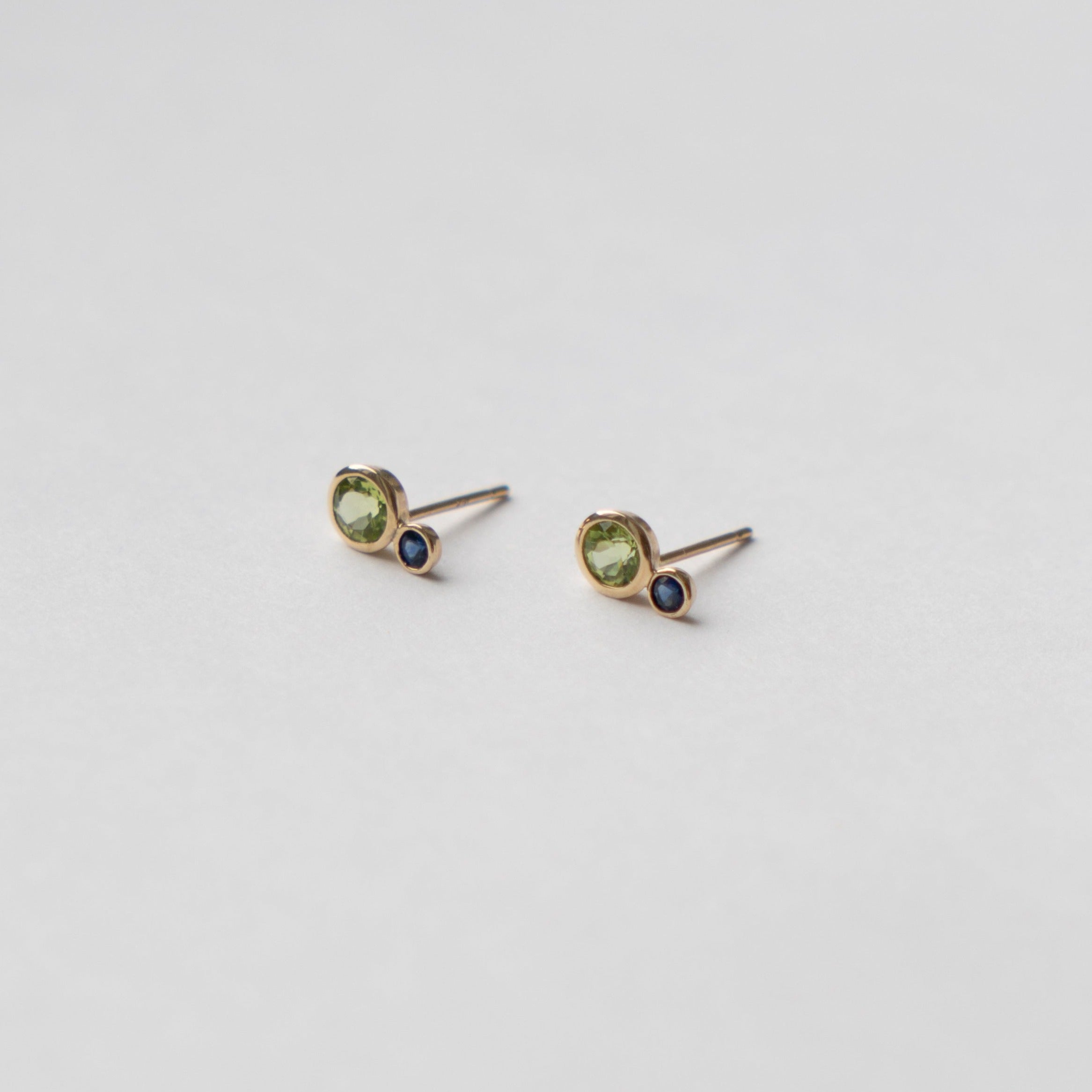Kiki alternative stud earrings in 14k gold set with peridot and sapphire