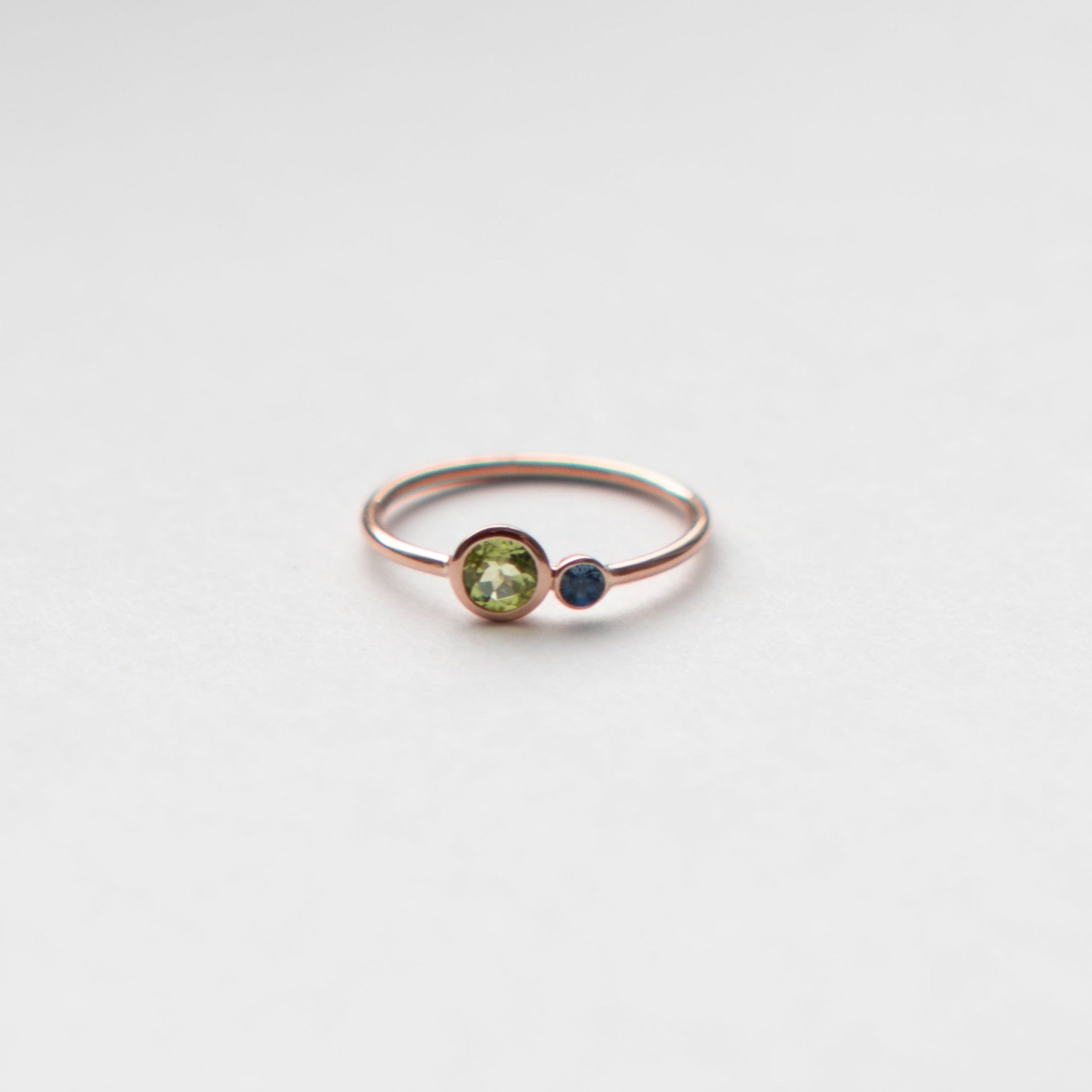 Kiki nontraditional ring in 14k rose gold set with peridot and sapphire