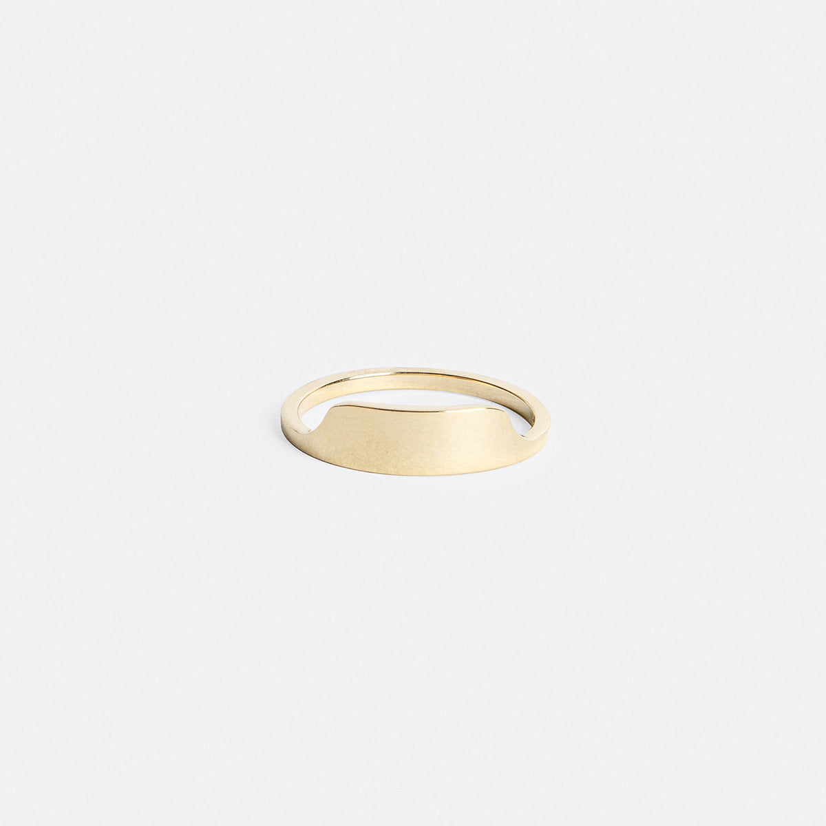 14k yellow gold thin ring with shield-shaped front detail