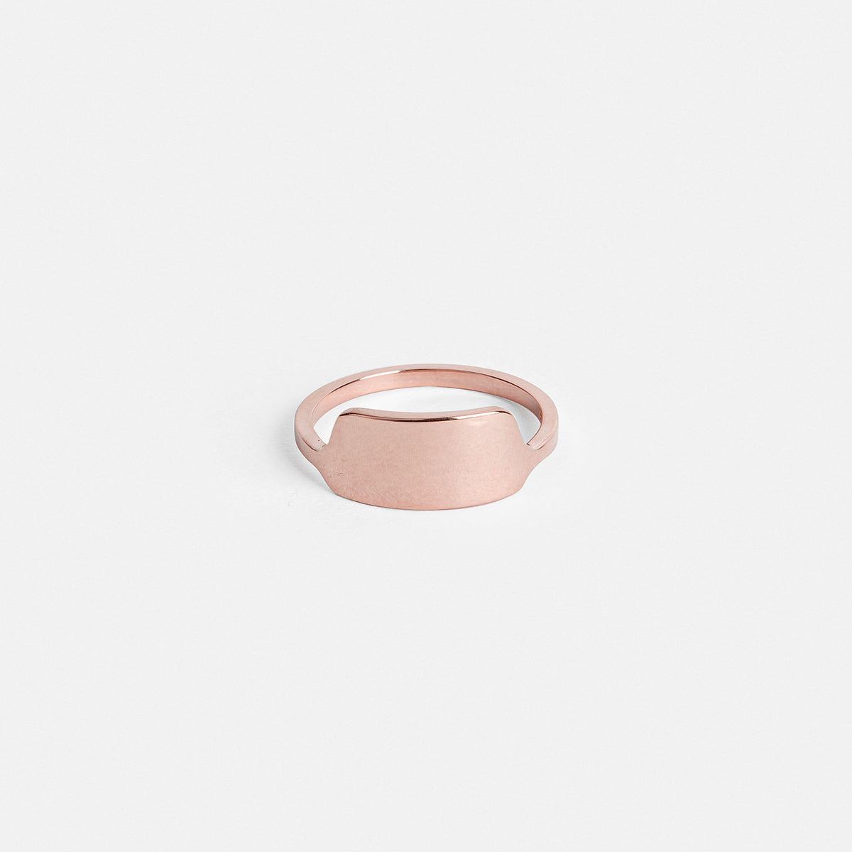 14k rose gold wedding band with shield-inspired front detail