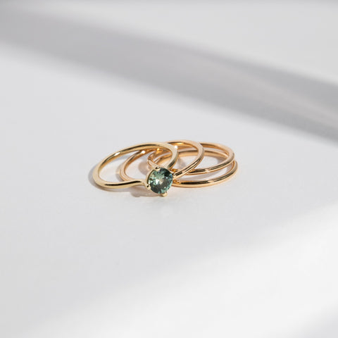 Velu Simple Ring in 14k Gold set with a 0.8ct green round brilliant cut sapphire By SHW Fine Jewelry NYC